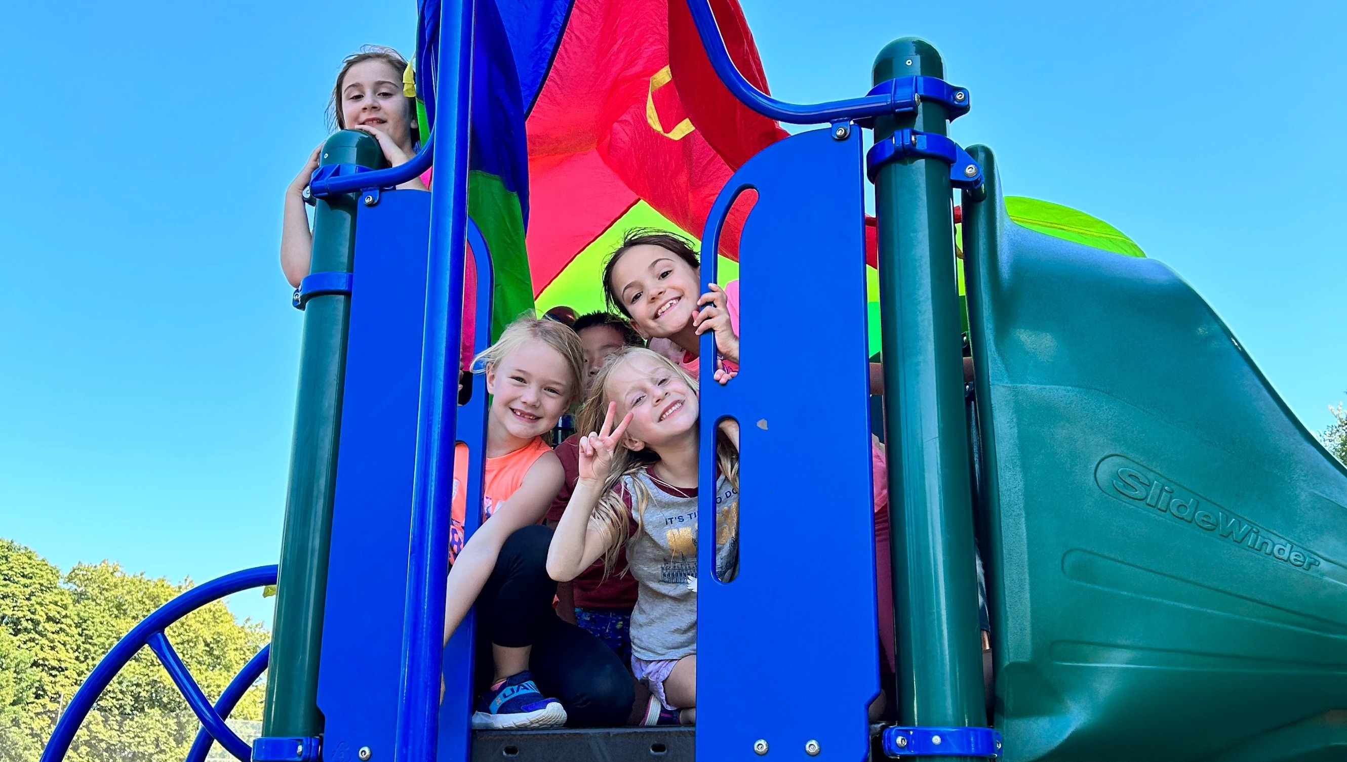 Kids posing for a photo on the playground