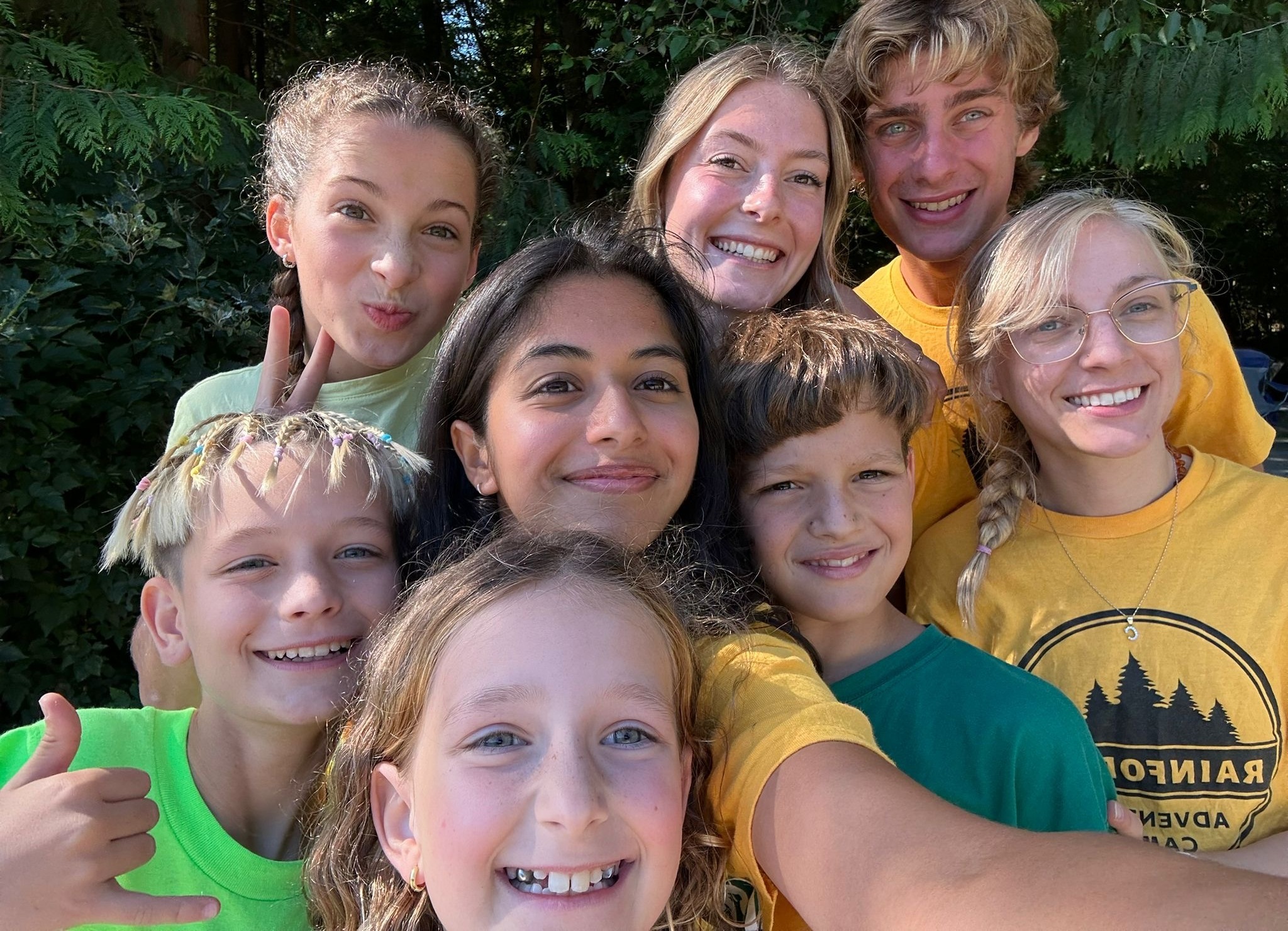 group of smiling campers and camp guides